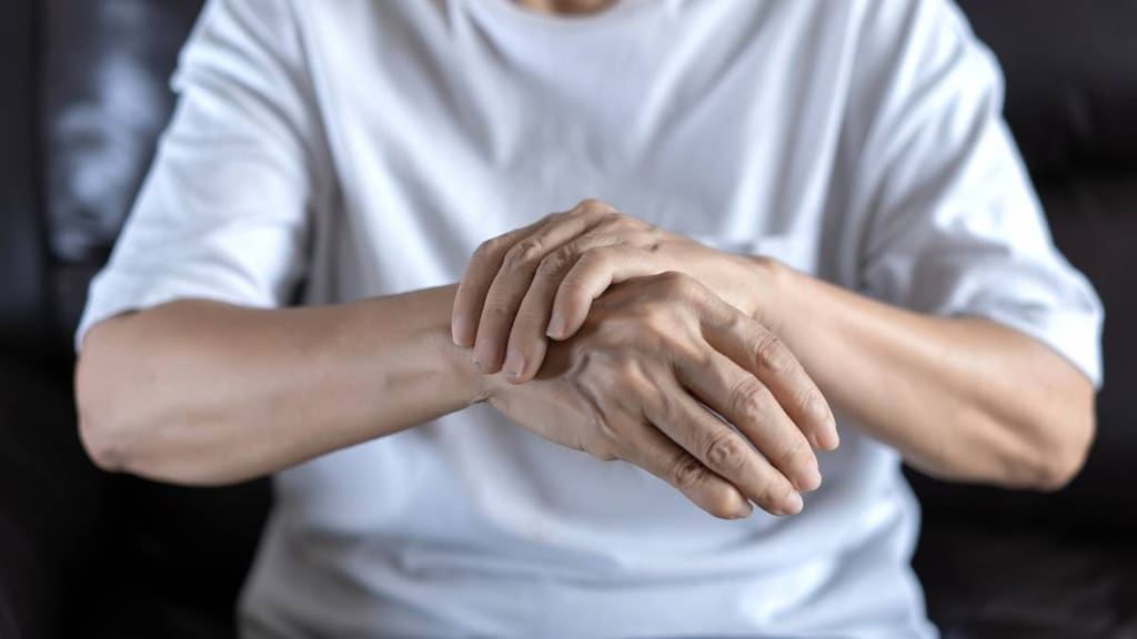 Older person with wrist pain